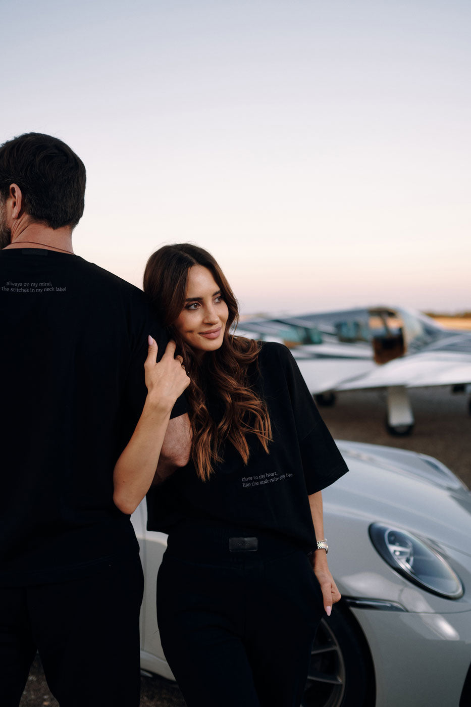 Woman wearing NOIRD women's black cotton t-shirt at sunset